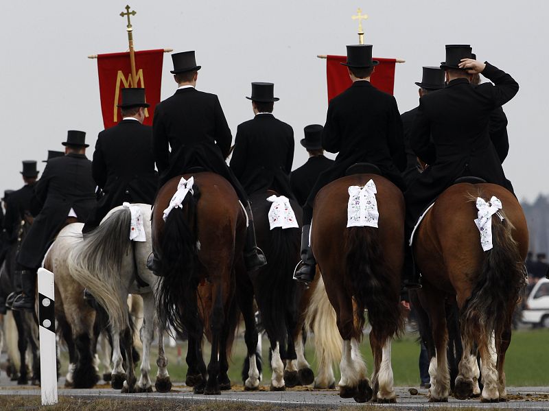 Men of the German Slavic minority Sorbs ride horses during a ceremonial Easter parade near the village of Ralbitz