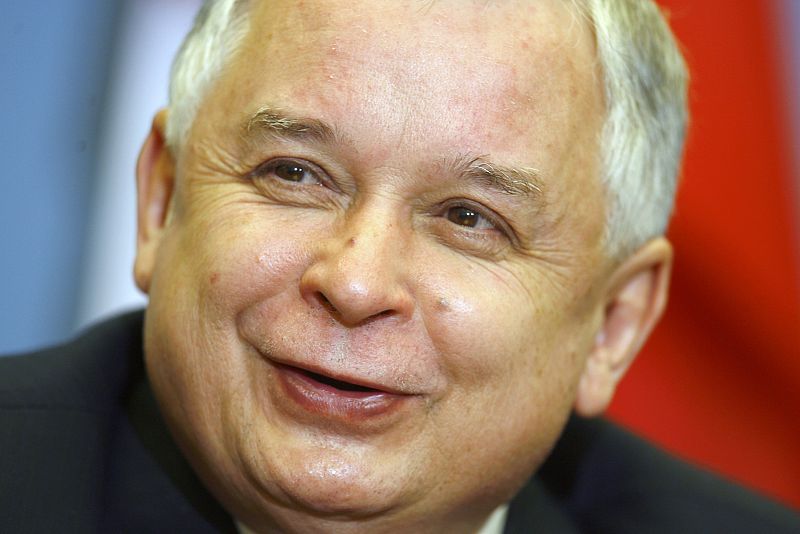 File photo shows Poland's President Kaczynski smiling as he speaks during a news conference in Vilnius