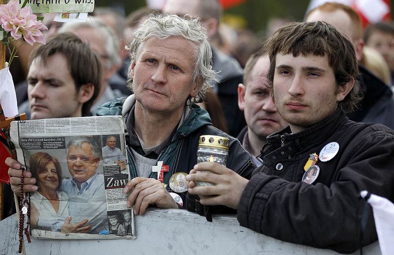 People attend commemoration ceremony for victims of plane crash in Smolensk at Pilsudski square in Warsaw