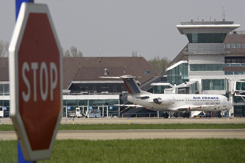 A plane is parked on the tarmac at Strasbourg airport in Entzheim