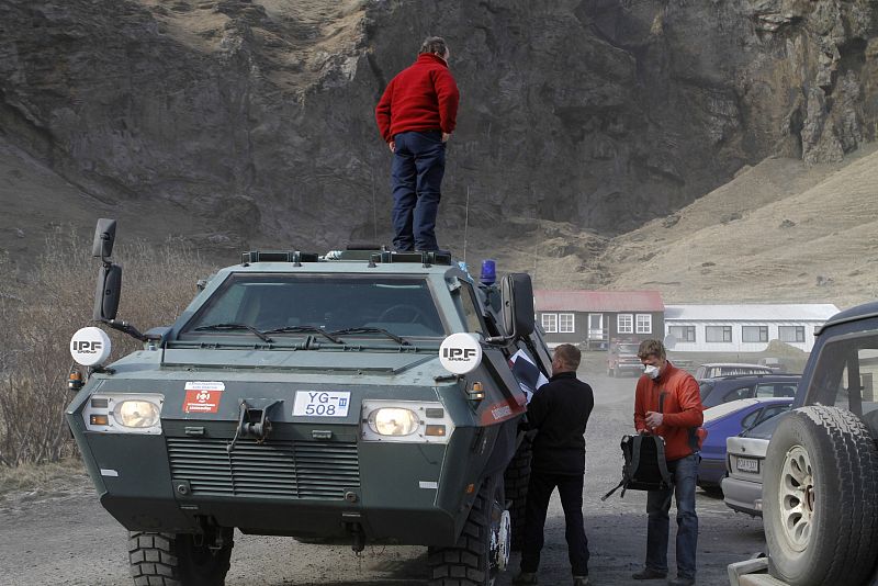 Residents prepare to evacuate in one of the armoured trucks of the Icelandic Civil Defense from the town of Eyjafjoll