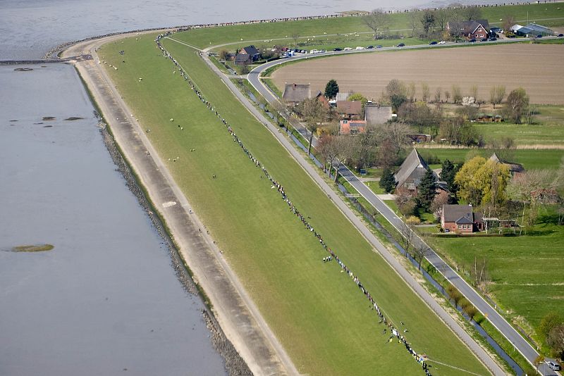 Aerial view shows anti-nuclear protesters as they form a human chain near the nuclear power plant Brokdorf