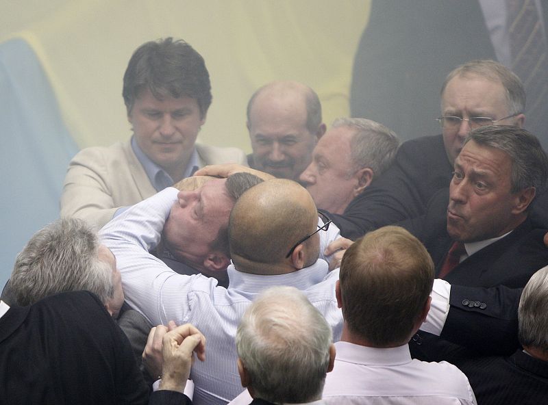 Deputies scuffle during a session in the chamber of the Ukrainian parliament in Kiev