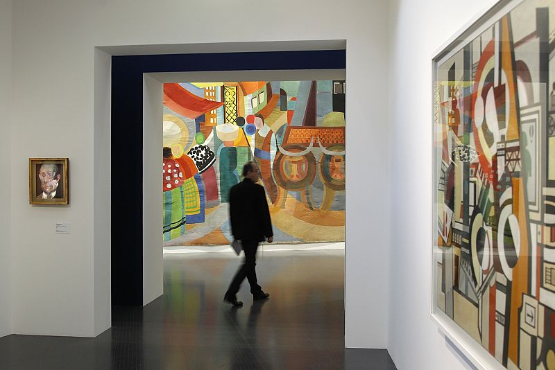 Visitor walks past the painting 'Portugal' by artist Sonia Delaunay during a visit of the Centre Pompidou-Metz museum