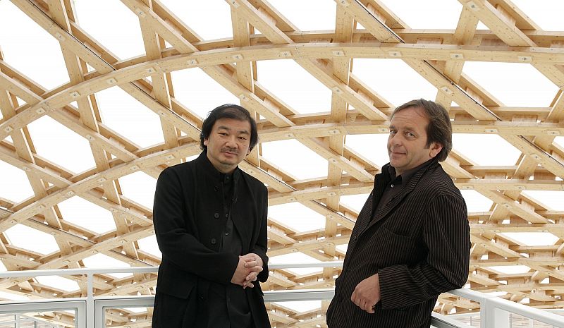 Japanese architect Shigeru Ban and his French partner Jean de Gastines pose during a visit of  the Centre Pompidou-Metz museum