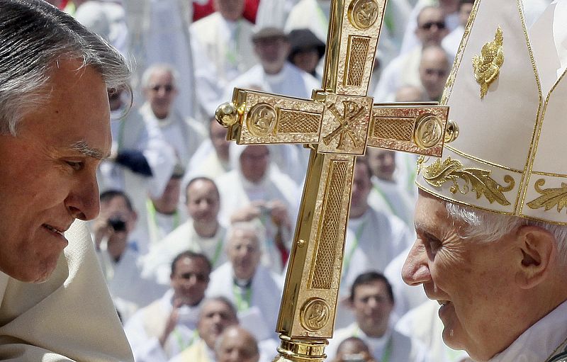 Pope Benedict XVI greets Portugal's President Anibal Cavaco Silva at the end of a mass in Fatima