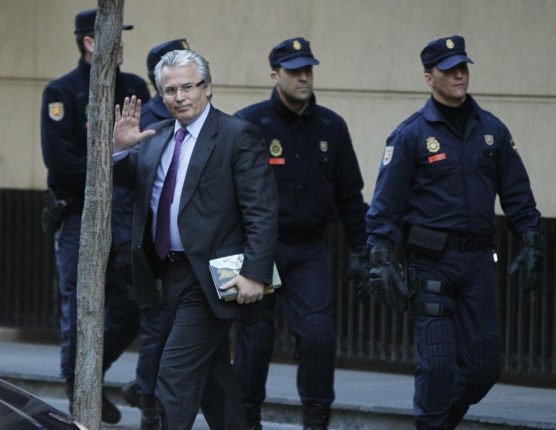 Spanish High Court judge Baltasar Garzon gestures as he leaves the High Court in Madrid
