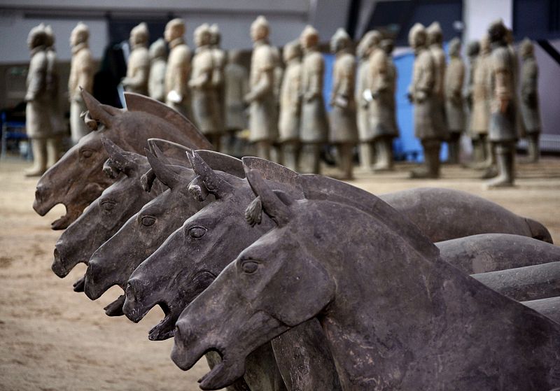 Terracotta warriors and horses stand in rows at the excavation site located on the outskirts of the Chinese city of Xian