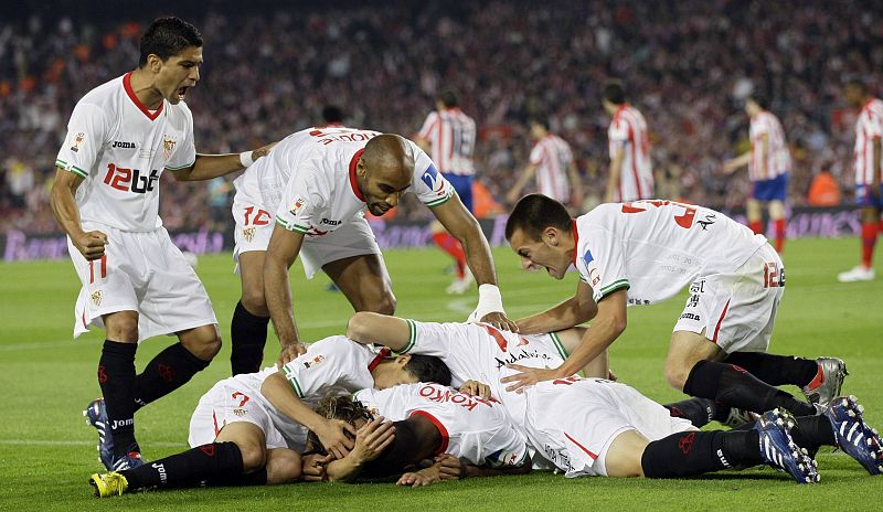 Sevilla's players celebrate their first goal against Atletico Madrid during their King's Cup final soccer match at Nou Camp stadium in Barcelona