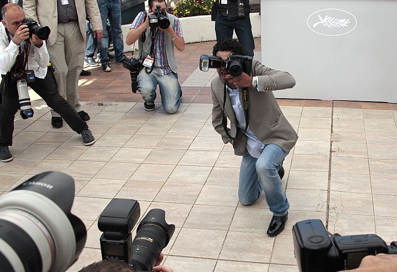 Cast member Debbouze jokes with the camera of a photographer during a photocall at the 63rd Cannes Film Festival