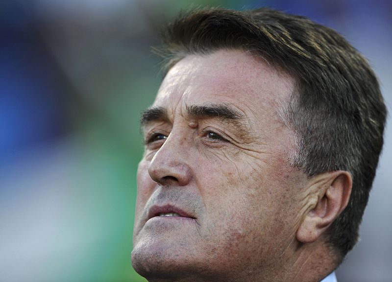 Serbia's coach Radomir Antic watches his players before the start of the 2010 World Cup Group D soccer match in Pretoria