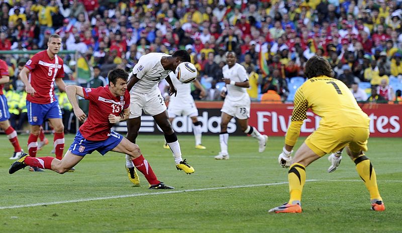 Ghana's Asamoah Gyan heads the ball against Serbia's Aleksandar Lukovic during a 2010 World Cup Group D soccer match at Loftus Versfeld stadium