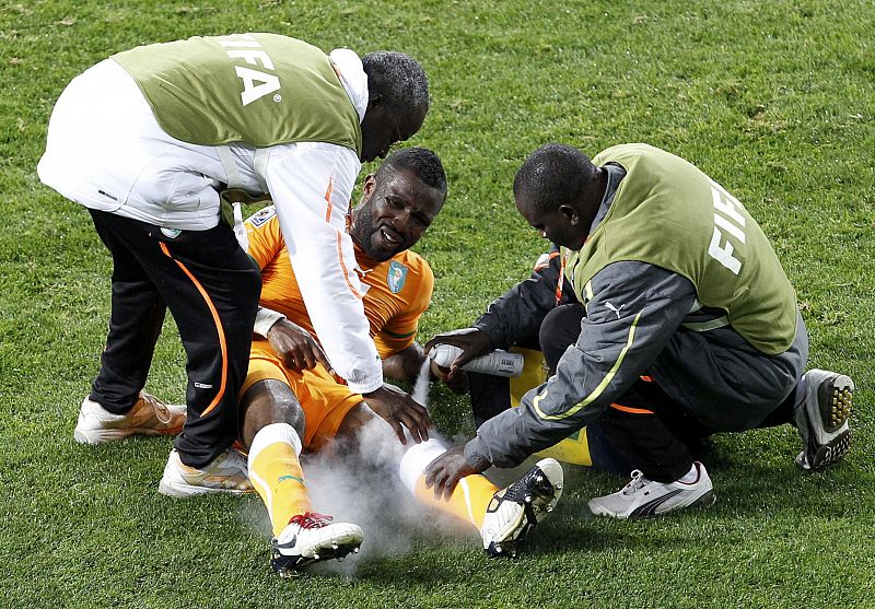 Ivory Coast's Siaka Tiene receives medical attention during a 2010 World Cup Group G soccer match against Portugal at Nelson Mandela Bay stadium in Port Elizabeth