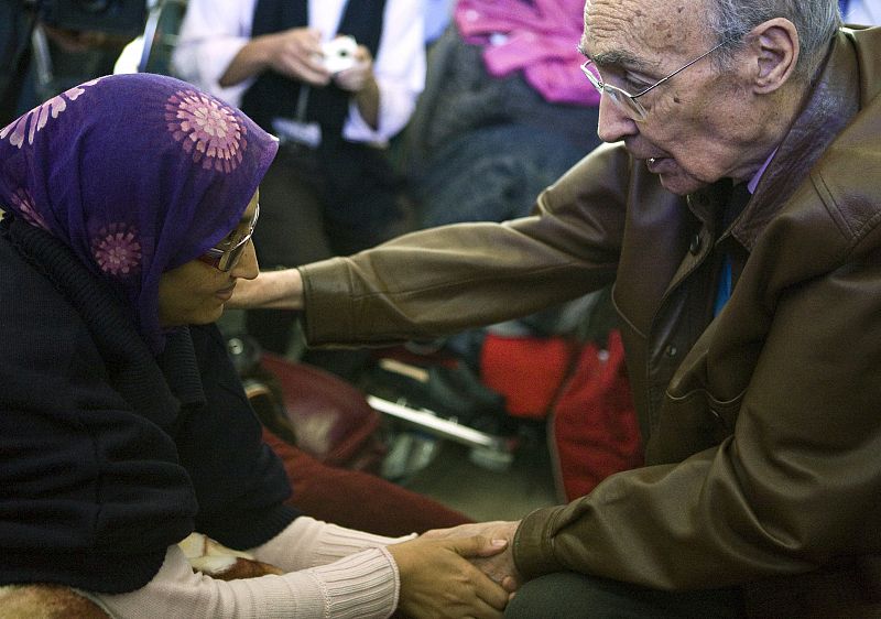 Prominent Western Sahara independence campaigner Haidar is greeted by Nobel winner Saramago at Guacimeta airport on Lanzarote