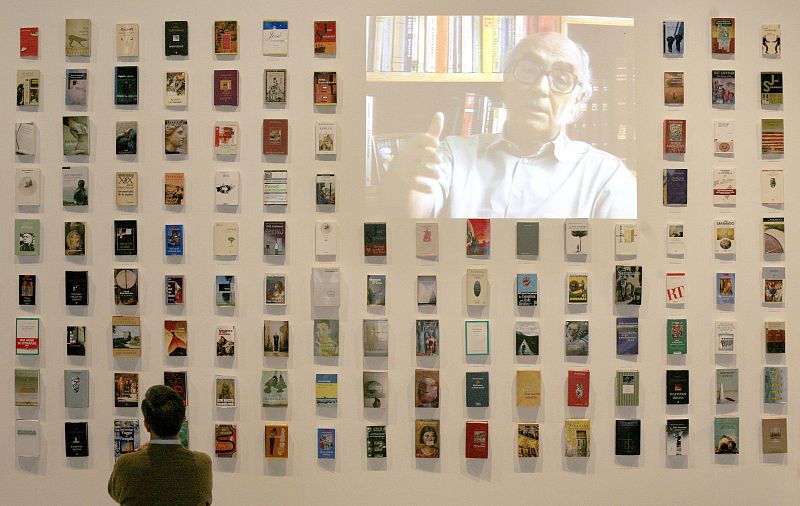 A man looks at Portuguese Nobel literature laureate Jose Saramago's books in an exhibition called "Consistencia dos Sonhos" in Lisbon