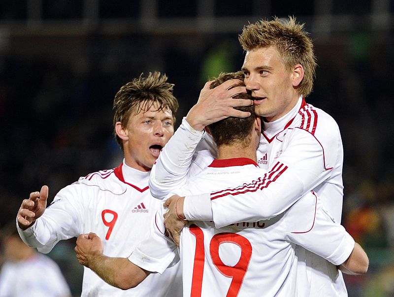 Denmark's Bendtner celebrates with team mates after scoring against Cameroon during a World Cup soccer match at Loftus Versfeld stadium in Pretoria