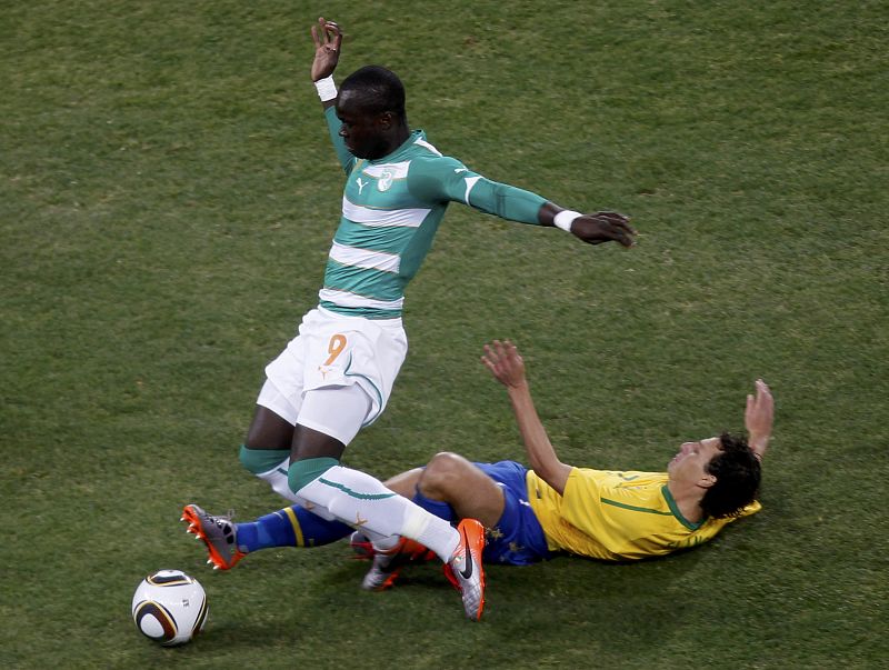 Ivory Coast's Tiote fights for the ball with Brazil's Elano during a 2010 World Cup Group G soccer match in Johannesburg