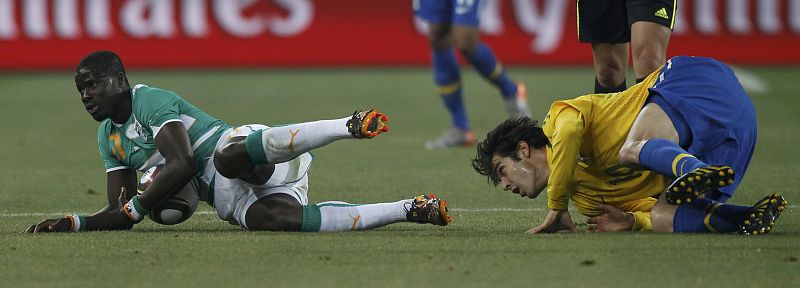 Ivory Coast's Siaka Tiene fights for the ball with Brazil's Kaka during their 2010 World Cup Group G soccer match at Soccer City stadium in Johannesburg