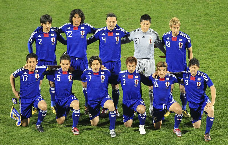 Japan's players pose for a team photograph before their 2010 World Cup Group E soccer match against Denmark at Royal Bafokeng stadium in Rustenburg June 24, 2010.