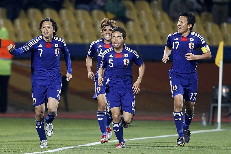 Japan's Endo  Okubo Nagatomo and Hasebe celebrate after scoring a second goal against Denmark during the 2010 World Cup Group E soccer match  in Rustenburg