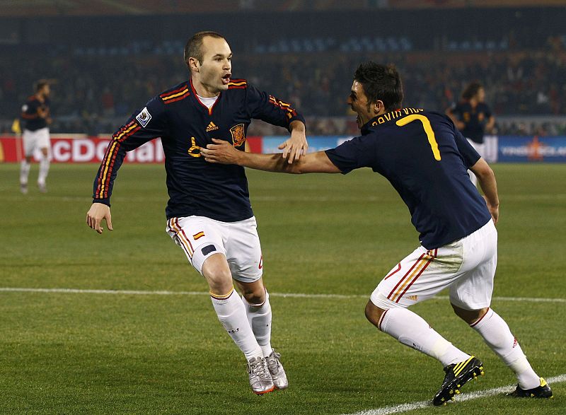 Spain's Iniesta celebrates his goal with David Villa during the 2010 World Cup Group H match against Chile at Loftus Versfeld stadium in Pretoria