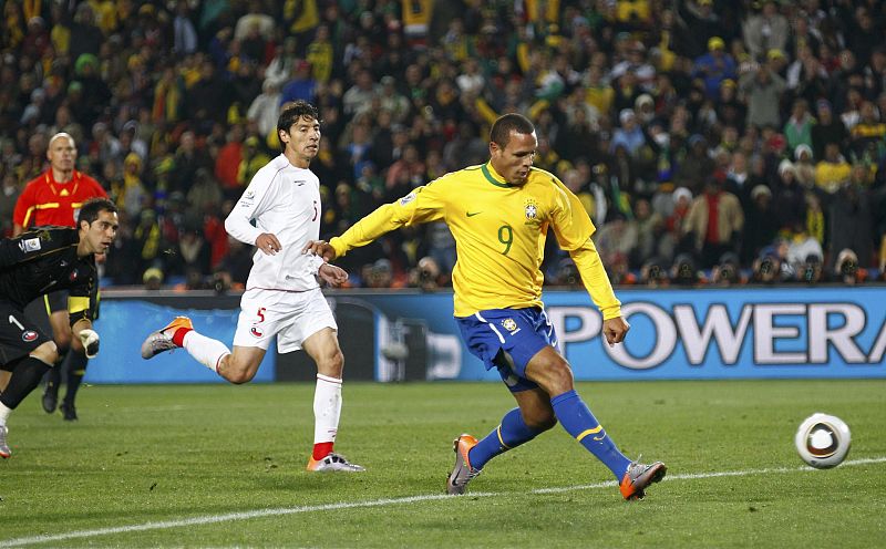 Brazil's Luis Fabiano scores a goal during the 2010 World Cup second round soccer match against Chile at Ellis Park stadium in Johannesburg