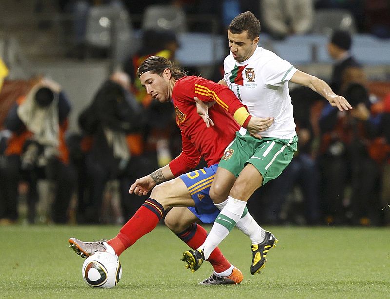 Spain's Ramos fights for the ball against Portugal's Simao during the 2010 World Cup second round soccer match at Green Point stadium in Cape Town