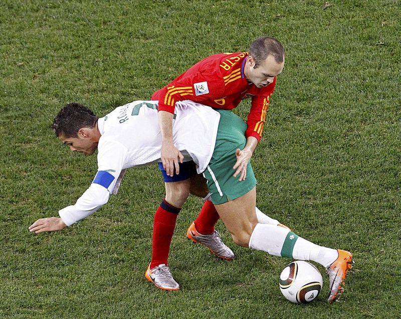 Spain's Iniesta fights for the ball with Portugal's Ronaldo during the 2010 World Cup second round soccer match at Green Point stadium in Cape Town