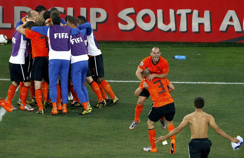 TestNetherlands' Wesley Sneijder and teammate John Heitinga celebrate after their 2010 World Cup quarter-final soccer match in Port Elizabeth