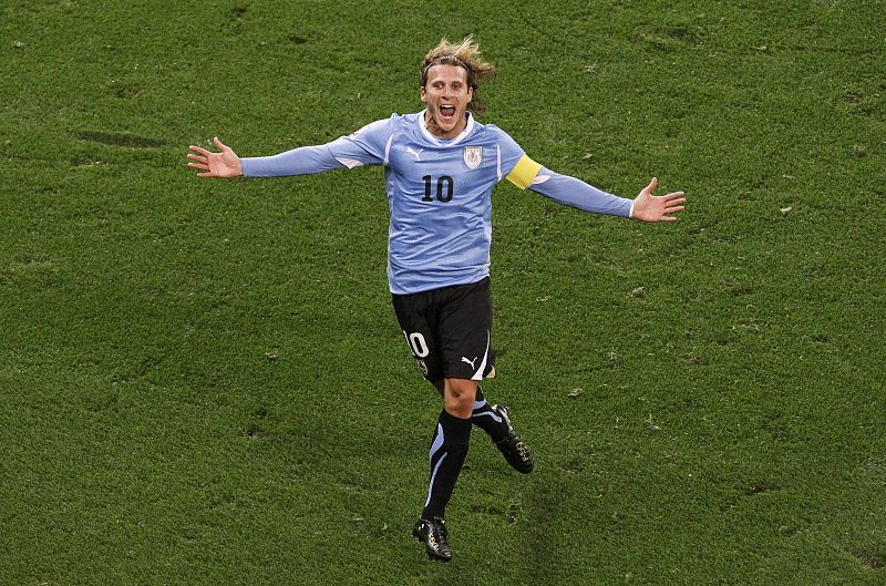 Uruguay's Diego Forlan celebrates his goal during the 2010 World Cup semi-final soccer match against the Netherlands at Green Point stadium in Cape Town