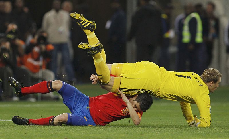 Germany's goalkeeper Manuel Neuer collides with Spain's David Villa during their 2010 World Cup semi-final soccer match at Moses Mabhida stadium in Durban