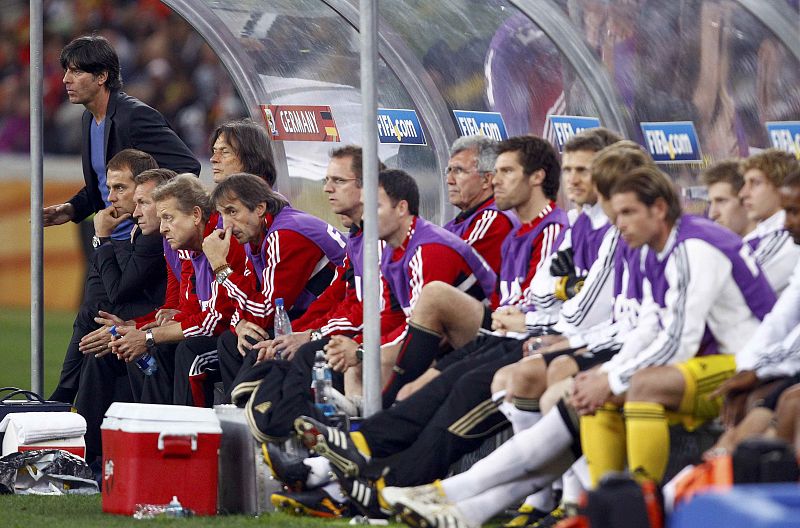 Germany's coach Joachim Loew watches the match with his team during their 2010 World Cup semi-final soccer match against Spain in Durban