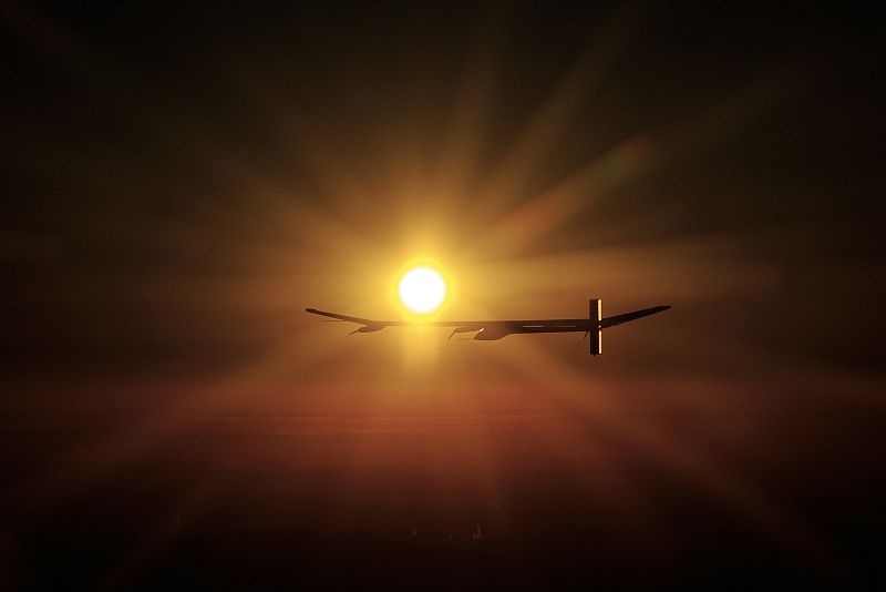 Solar Impulse's CEO and pilot Andre Borschberg flies the solar-powered HB-SIA prototype plane at sunrise during its first night flight attempt near Payerne airport