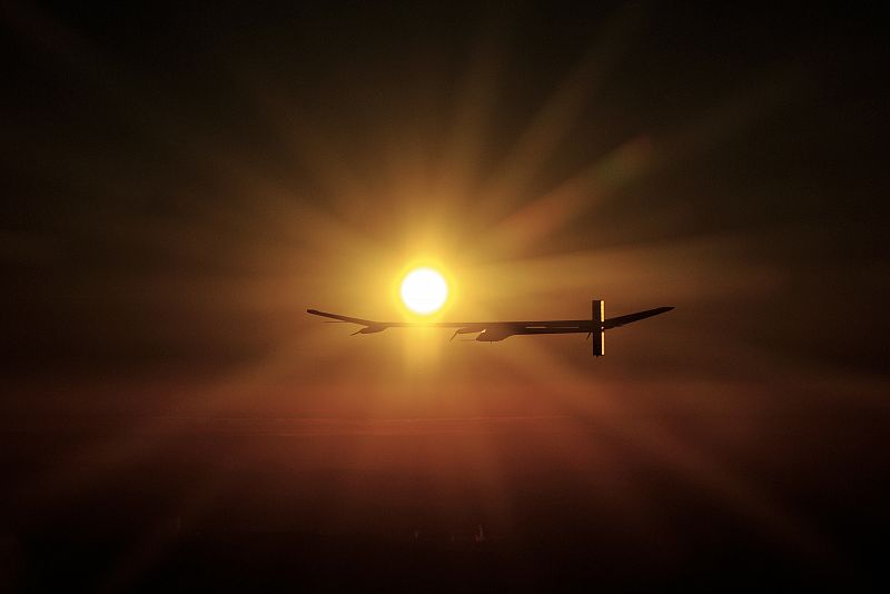 Solar Impulse's CEO and pilot Andre Borschberg flies the solar-powered HB-SIA prototype plane at sunrise during its first night flight attempt near Payerne airport