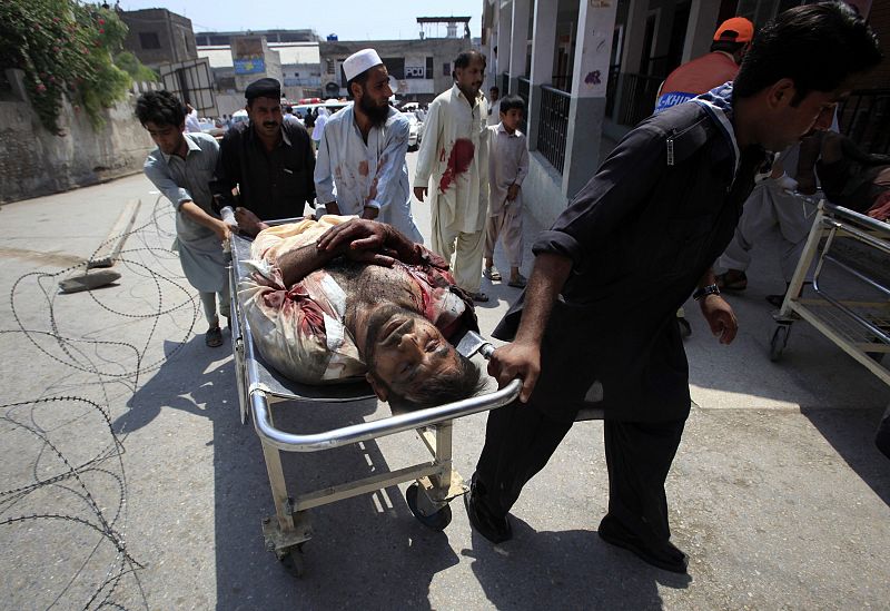 A man injured in a suicide bomb blast in Pakistan's Mohmand ethnic Pashtun tribal region, is brought to Lady Reading Hospital in Peshawar