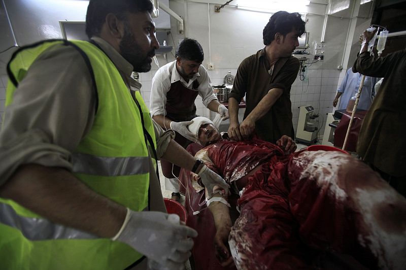 A man injured in a suicide bomb blast in Pakistan's Mohmand ethnic Pashtun tribal region, is treated at Lady Reading Hospital in Peshawar