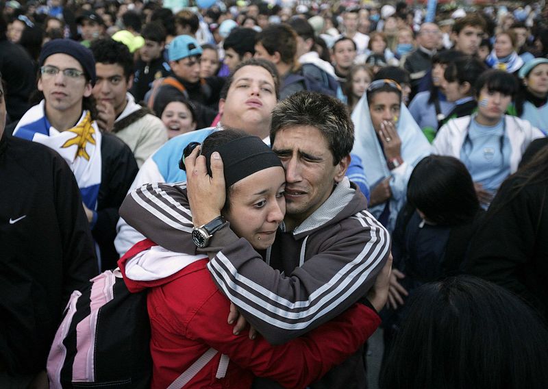 Uruguayan fans react at the end of the 2010 World Cup third place playoff soccer match against Germany at a televised screening at Plaza Independencia in Montevideo
