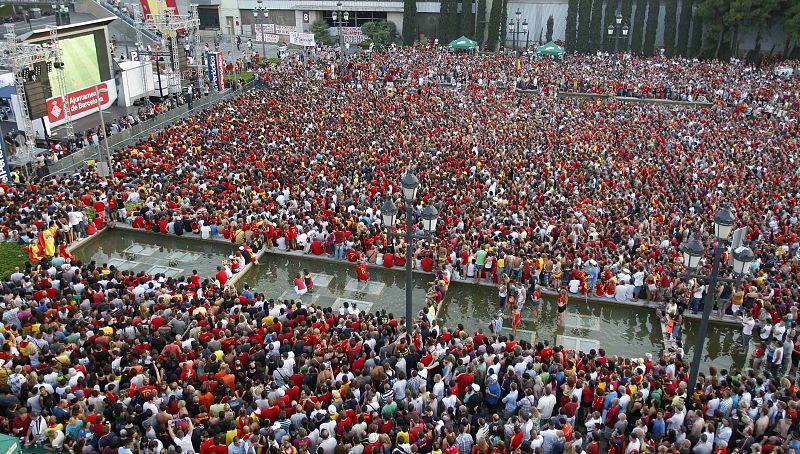 Spanish fans watch on a public screen the 2010 World Cup final soccer match between Spain and Netherlands in Barcelona