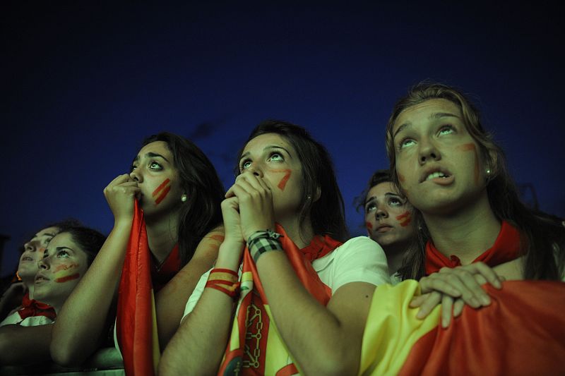 Spain fans watch the 2010 World Cup final soccer match between Spain and the Netherlands on an outdoor TV screen at the Plaza de Castillo in Pamplona