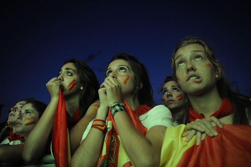 Spain fans watch the 2010 World Cup final soccer match between Spain and the Netherlands on an outdoor TV screen at the Plaza de Castillo in Pamplona