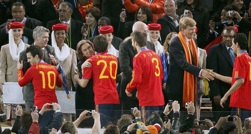 Spanish players received their medals from VIPs including Spain's Queen Sofia and Netherlands' Crown Prince Willem Alexander after their 2010 World Cup final soccer match victory against the Netherlands at Soccer City stadium in Johannesburg