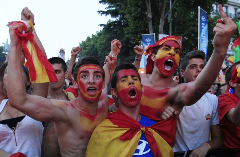 Spain's soccer fans react as they watch a public screening of the World Cup 2010 final soccer match in downtown Madrid