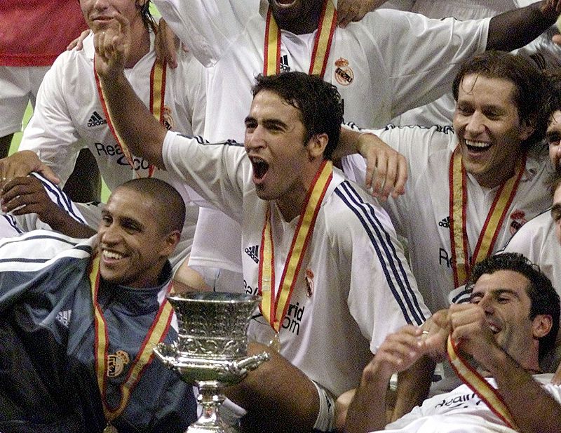 REAL MADRID'S STRIKER RAUL AND HIS TEAM CELEBRATE AFTER CLINCHING