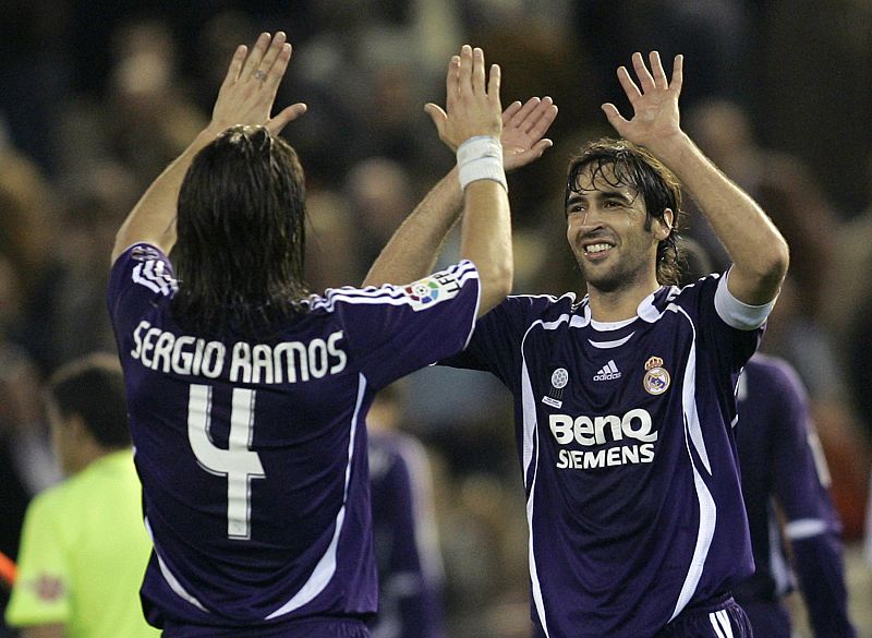 Real Madrid's Raul Gonzalez and Ramos celebrate at the end of their Spanish First Division soccer match against Valencia in Valencia