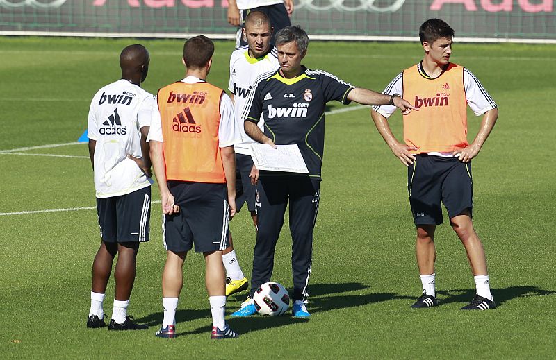 Real Madrid's new coach Mourinho gives instructions to players during Real Madrid's first training session in Madrid