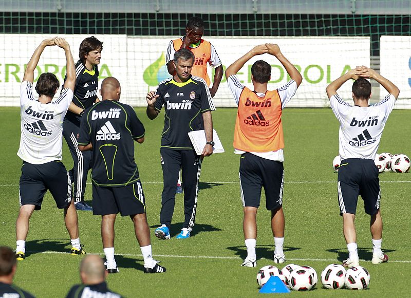 Real Madrid's new coach Mourinho gives instructions to players during Real Madrid's first training session in Madrid
