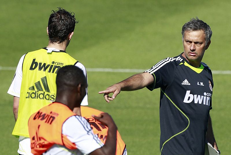 Real Madrid's new coach Mourinho gives instructions to players during Real Madrid's first training session in Madrid