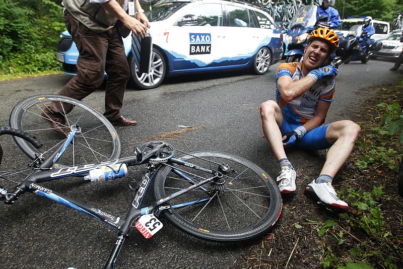 Garmin-Transitions' Tyler Farrar of the U.S sits on the road after a crash in the second stage of the Tour de France cycling race from Brussels to Spa