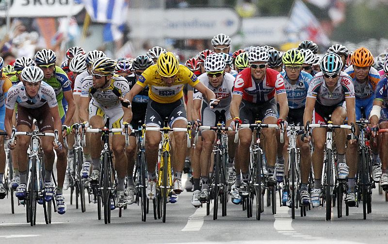 Saxo Bank rider Fabian Cancellara of Switzerland gestures as the peloton crosses the finish line of the second stage of the Tour de France cycling race from Brussels to Spa