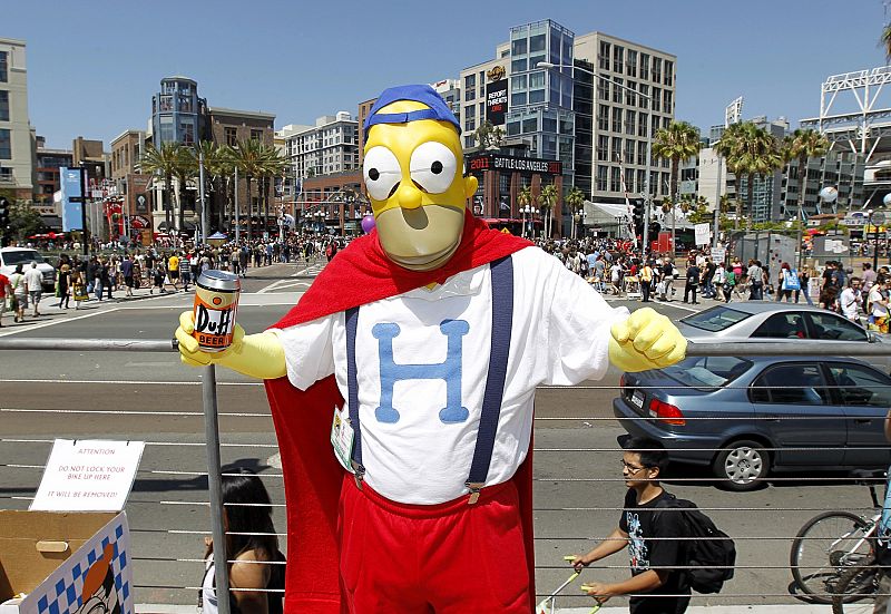 An attendee arrives dressed as Homer Simpson, from the television show "The Simpsons" during the third day of the pop culture convention Comic Con in San Diego